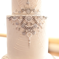 Bling Two tiered fondant cake with edible jewels.