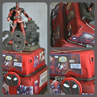 Deadpool Cake toy on top, comic strips are edible image