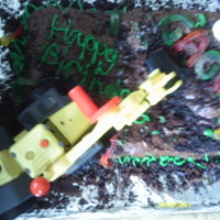 Construction Cake This is a construction cake I made for my son's 3rd birthday. It was a chocolate cake with chocolate frosting. It had crushed cookies...