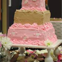 From God Amaretta and chocolate layered with buttercream frosting. The baby and blanket are made from fondant