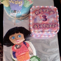 Dora Cake Made for a 3 year old, who loves Dora, but part was having about 40 people, so had to get more cake in the picture.
