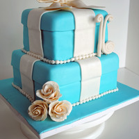 Sweet 16 Tiffany Cake White cake with Lemon filling8 inch and 6 inch squareVanilla fondant with gum paste accents