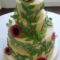 Pink Anenone Wedding Cake 4 tiers of cake iced in vanilla IMBC. Stems of vines are piped pn and then I added the gumpaste leaves. So proud of these anenomes. Flowers...