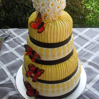 Yellow Modern Wedding Cake This is not my design. The bride brought me a picture torn from a magazine that was originally done in all fondant. I duplicated to the...