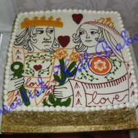 King And Queen Of Hearts 12 inch square carrot cake with cream cheese icing. The image was hand drawn on the cake to look like a postage stamp design