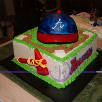 Atlanta Braves Basic white cake with buttercream & MMF covered. The entire cake is edible, with the exception of the hat bill, which is a piece of...
