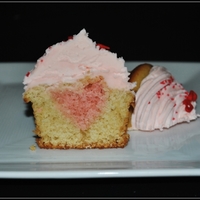Heart-Filled Cupcakes Vanilla cupcakes, strawberry laffy taffy frosting. First try at putting a shape inside my cupcakes...very easy and cute! TFL!