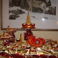 Christmas Party Display The main cake is rich fruit cake. Irish cream cupcakes, Gingerbread cupcakes, 50/50 gum paste/fondant sleigh & trees.This was a lot of...