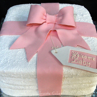 Stack Of Nappies (Diapers) Chocolate cake filled/ganached/fondant/royal icing coating to give toweling effect. Gumpaste ribbon bow and tag!