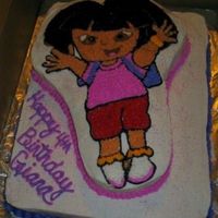 Dora The Explorer 1/2 sheet white cake with Dora the explorer shape pan.