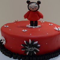 Puka 10 inch chocolate cake, covered in fondant decorated with gumpaste