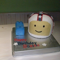 Lego Head With Evil Knievel Helmet Couldn't decide if he wanted a lego cake or an Evil Knievel cake.