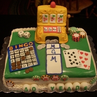 Grandma's Gambling Cake Fondant cake topped with fondant, gum paste, and krispie treats covered in fondant. Features a bingo card, poker chips, dice, cards, and a...