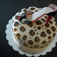 High Heel Cake Gum paste high heel shoe on leopard print fondant cake.