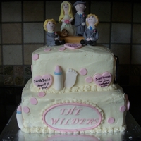 Vow Renewal Cake A 2 tier, square cake, iced in buttercream and adorned with fondant decorations. The cake features a timeline of the couple's history...