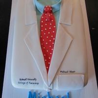 White Coat Celebration Cake For A Pharmacy Graduation Two Layer 9 X 13 Cake With Buttercream Frosting And Marshmallow Fondant White Coat celebration cake for a Pharmacy graduation. Two layer 9 x 13 cake with buttercream frosting and marshmallow fondant.