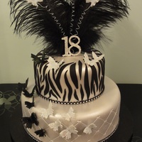 This Cake Is Covered In Fondant And Airbrushed In Silver Then Decorated With Fondant Animal Print And Gumpaste Butterflies It Was Really Sp... This cake is covered in fondant and airbrushed in silver then decorated with fondant animal print and gumpaste butterflies. It was really...