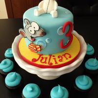 Julian's Toopy And Binoo Fun Toopy and Binoo themed cake. Everything is fondant, including figure and 2D fondant image handcut. Coordinating cupcakes.