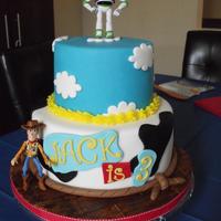 Toy Story Toy Story themed cake I made for my son. Buzz and Woody are toys, the rest is fondant.
