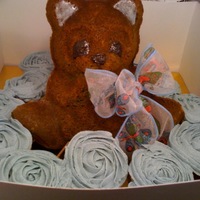Baby Bear With Cupcakes Baby bear cake eyes, ears and nose of gel color; rose cupcakes for office shower; ribbon bow matched other shower decor