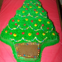 Christmas Tree This is a French Vanilla Cake covered in buttercream frosting and decorated in more buttercream and little colored candies