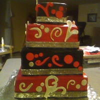 Red & Black Wedding Theme This cake designed by the bride and groom. Buttercream frosting/fondant designs with silver luster dust. They loved it. Text me a thank you...