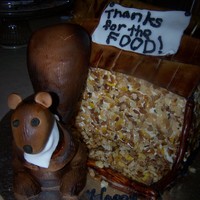 Bird Feeder And Squirrel Choc. cake with choc icing layers and buttercream covering the cake. Airbrushed rice cereal yellow and brown and had choc. sprinkles for...