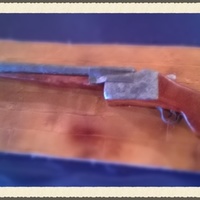 12 Gauge Shotgun Gun Stock Is Cake Barrels Are Fondant Covered Dowels Wood Grain Texture Mat That Has Been Airbrushed 12 gauge Shotgun. Gun stock is cake, barrels are fondant covered dowels. Wood grain texture mat that has been airbrushed.