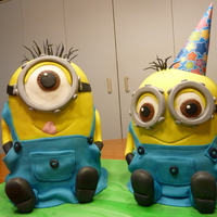 Two Little Minionsone Is 5 Layers And Other Is 4 Layers Of Chocolate Cake Covered In Chocolate Ganachethen Cavered In Mmf Two little Minions...one is 5 layers and other is 4 layers of chocolate cake covered in chocolate ganache...then cavered in MMF