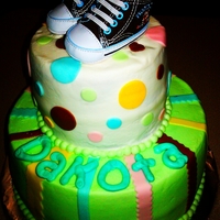 Baby Butter cream with fondant accents. The shoes were purchased and added to the cake