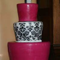Damask Wedding Cake Covered in rolled fondant and airbrushed with a damask pattern on the middle tier.