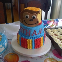 Curious George I made this for my son's 2nd birthday. The cake was iced in buttercream and curious george was done in fondant.