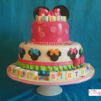 Bellas Birthday Cake Cake made to match Minnie mouse bowtique theme. The client added 2 toys at the party