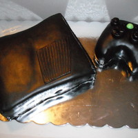 Xbox 360 Strawberry cream cake, freshberries layered in the middle, lemon dream frosting. Fondant and gm accents, there are little lites in the...