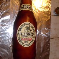 Guiness Bottle this is to scale Guiness bottle done with fondant, all labels hand painted with food coloring.
