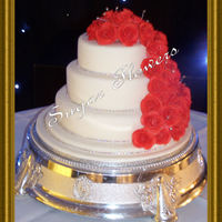 Cara Chocolate 10" and 6", vanilla 8". With 45 handmade roses. Also a diamante 'ribbon' around each tier. TFL