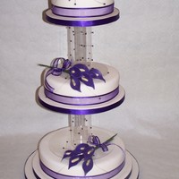 Helen This was for my cousins wedding. The top tier is fruit, middle is chocolate orange, and the bottom tier is vanilla. The separators are...