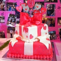 Pink Hearts And Bows Gift Boxes 12" and 8" chocolate cake with ganache and fresh raspberry filling, covered in fondant