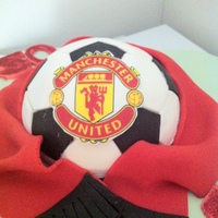 Man Utd 50Th Birthday 50th birthday for a friend who is Utd mad Orange/countreau cake with chocoalte ganache filling covered in fondant, with gumpaste figure TFL...