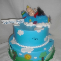 Baby And Dog Flying Mommy to be loved the cake. Daddy is a pilot. Buttercream and fondant.