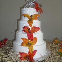 25Th Wedding Anniversary Buttercream frosting with fondant accents. Flowers were silk.