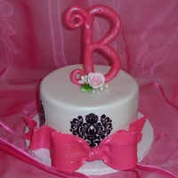 Pink And Black Baby Shower This is the 6 inch cake for the top of cupcake display.