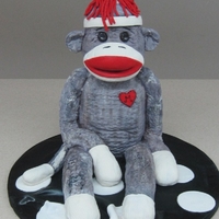 Sock Monkey This cake was made for a girl that loves sock monkeys so what better to give her for her birthday than a sock monkey cake.He sits on her...