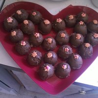 First Attempt Cake Truffles sprite cake balls dipped in chocolate melts with royal icing flowers on top. this is my first attempt at making them. TFL!