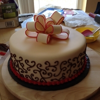 Bridal Shower Cake Orange creamsicle with vanilla filling. Covered in fondant and piped with frosting. Bow made out of gumpaste. Brides colors where champagne...