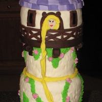 Tangled Rapunzels Tower Cake 6", 5", 4" round cakes covered in fondant top is rice crispy treats shaped in 5" pan and shaped roof then covered in...