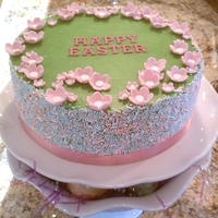 Happy Easter! 8" lemon cake with raspberry filling, green vanilla SMBC with spring sprinkles and gumpaste blossoms.