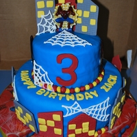 Spiderman 3Rd Birthday Cake A 6 and 10 inch fondant covered cake. Fondant/gum paste buildings, color flow spiderman heads, royal icing spiderwebs, and buttercream...