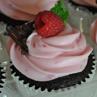 Dark Chocolate Cupcake With Raspberry Cream Cheese Dark chocolate cupcake filled with a whipped dark chocolate ganache. Frosted with a fresh raspberry cream cheese and topped with a fresh...
