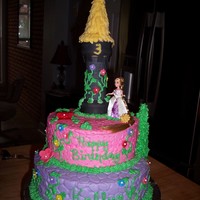 Tangled Rapunzel Loved this cake. All butter cream with fondant flowers. Tower is ice cream cones frosted with chocolate icing and then fondant